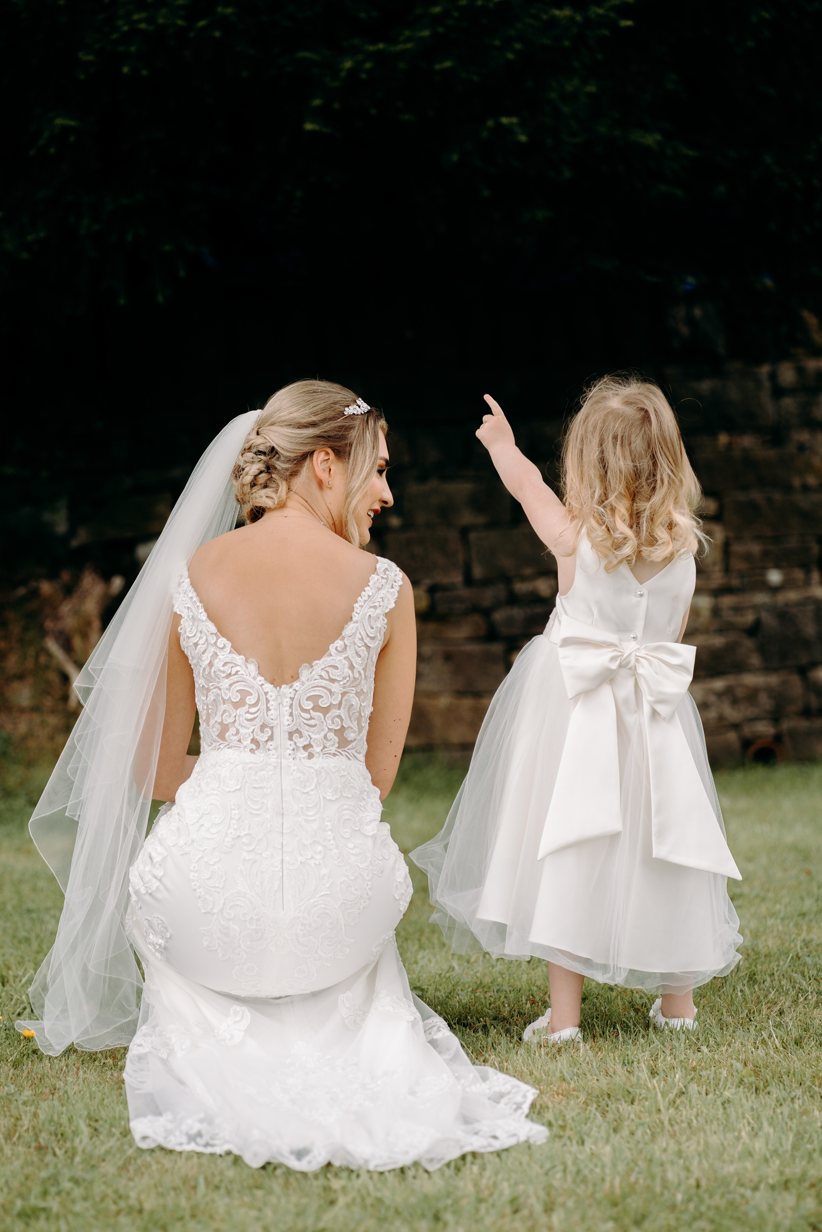 Bride having a moment with her flower girl