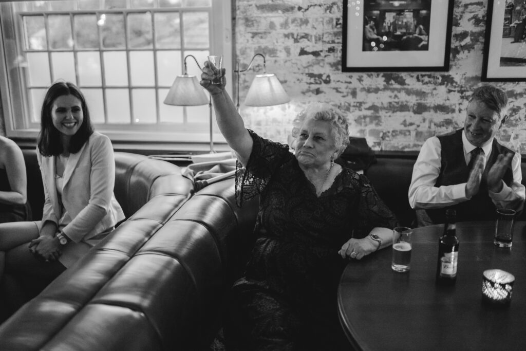 Granny does a shot at a wedding