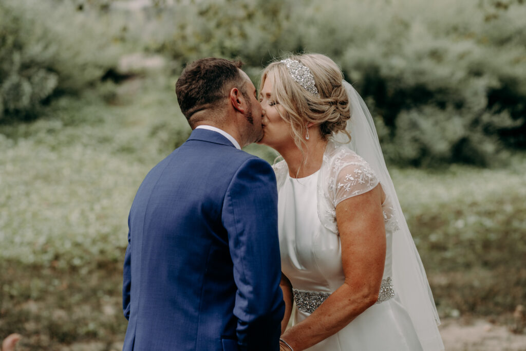 Bride and grooms' first kiss during New York elopement