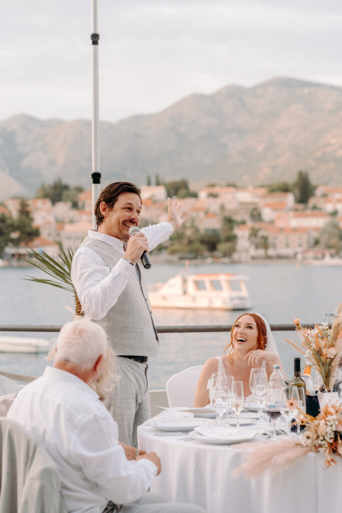grooms wedding speech looking out at cavtat, croatia