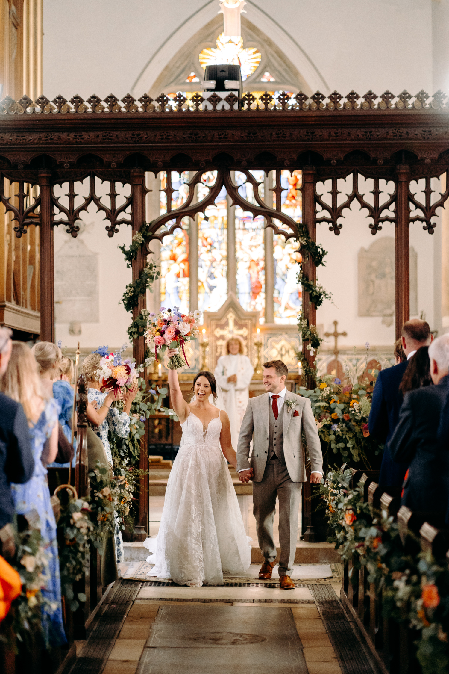 bride and groom coming out of their wedding ceremony at Leadenham church