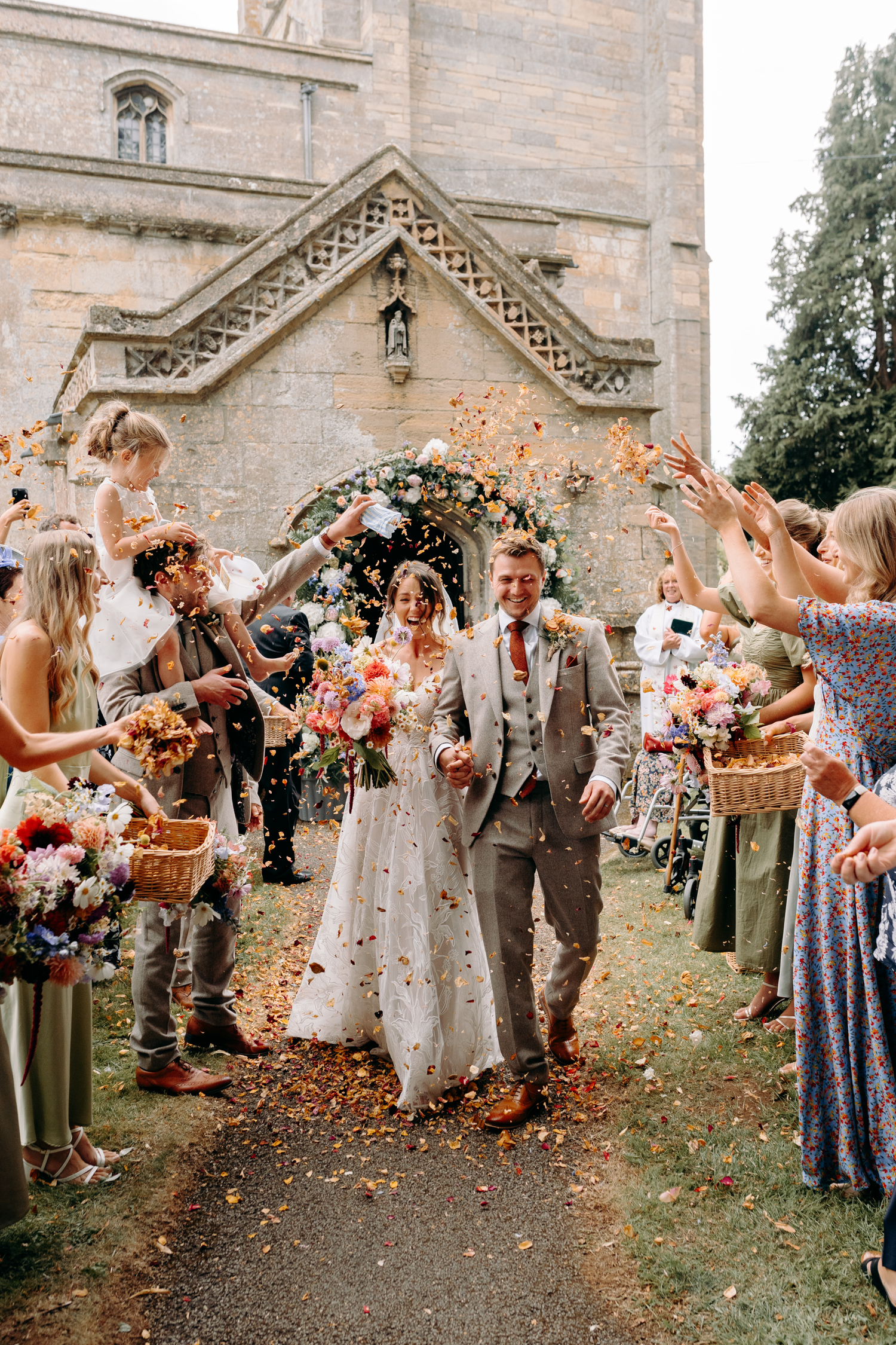 fun confetti photography outside church in lincolnshire