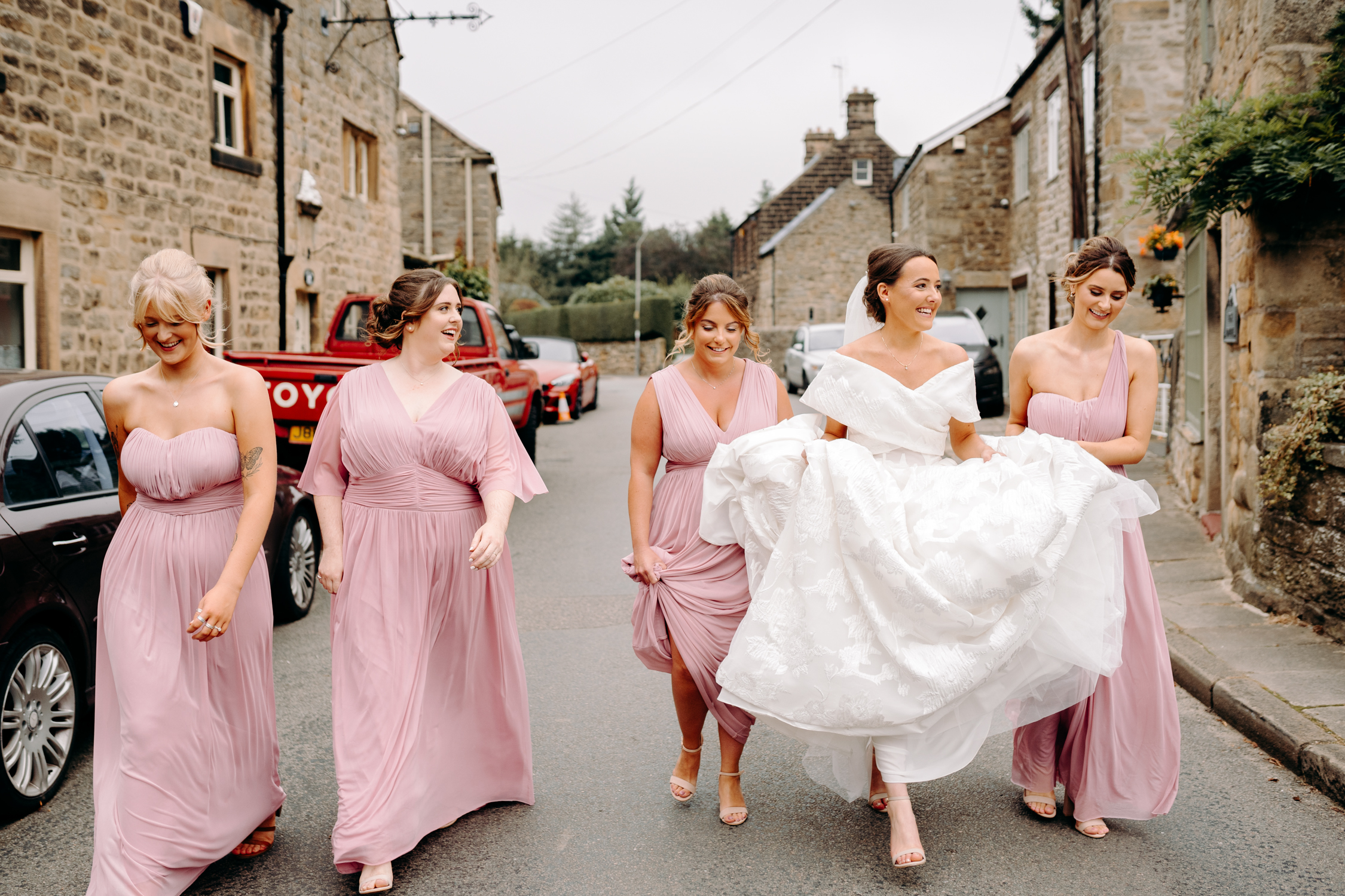 bride and bridesmaids walking to ashover church
