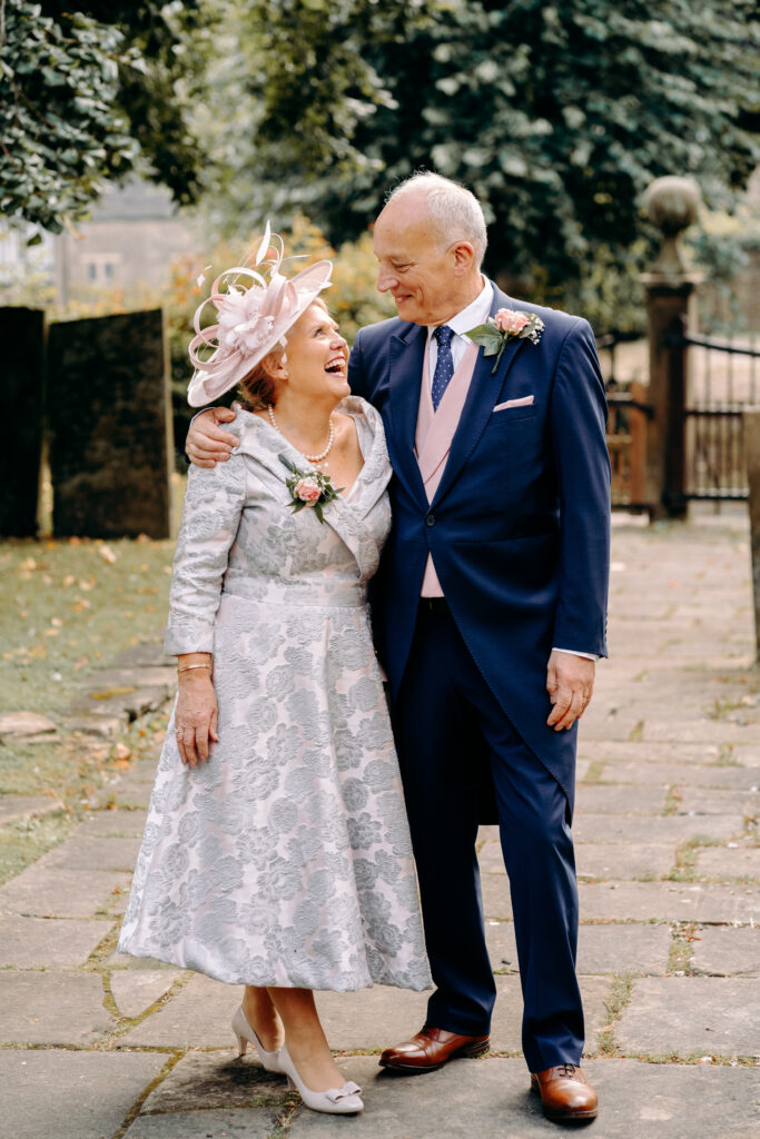 mother and father of the bride outside church in ashover