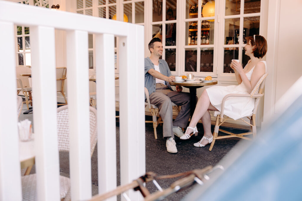 cute engagement photoshoot outside a cafe in Paris