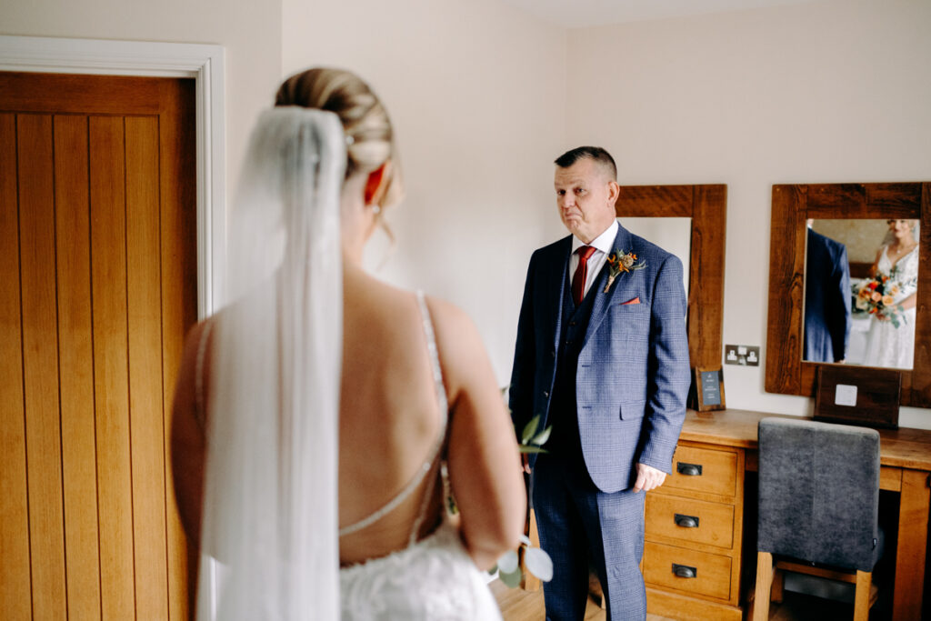 emotional first look with bride and dad