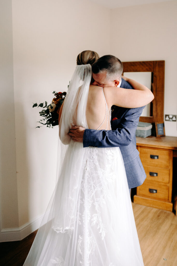emotional first look with bride and dad