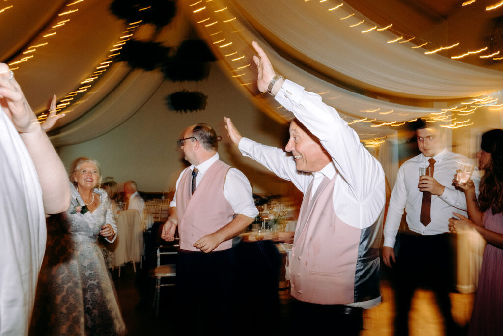 fun dance floor photography at village hall wedding in derbyshire