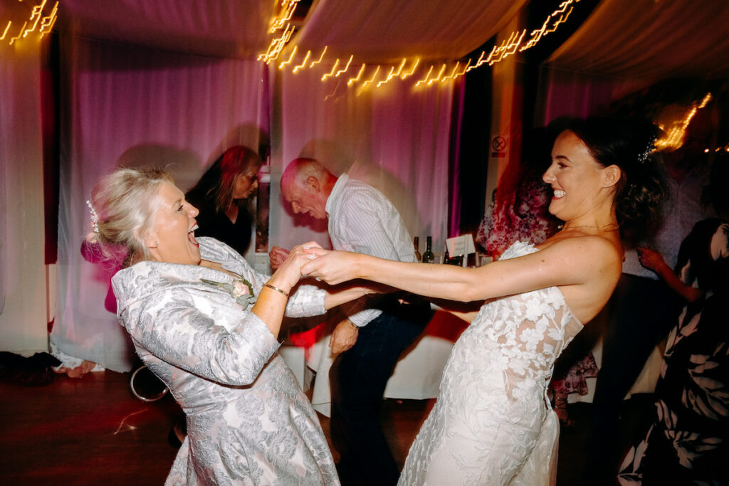 fun dance floor photography at village hall wedding in derbyshire