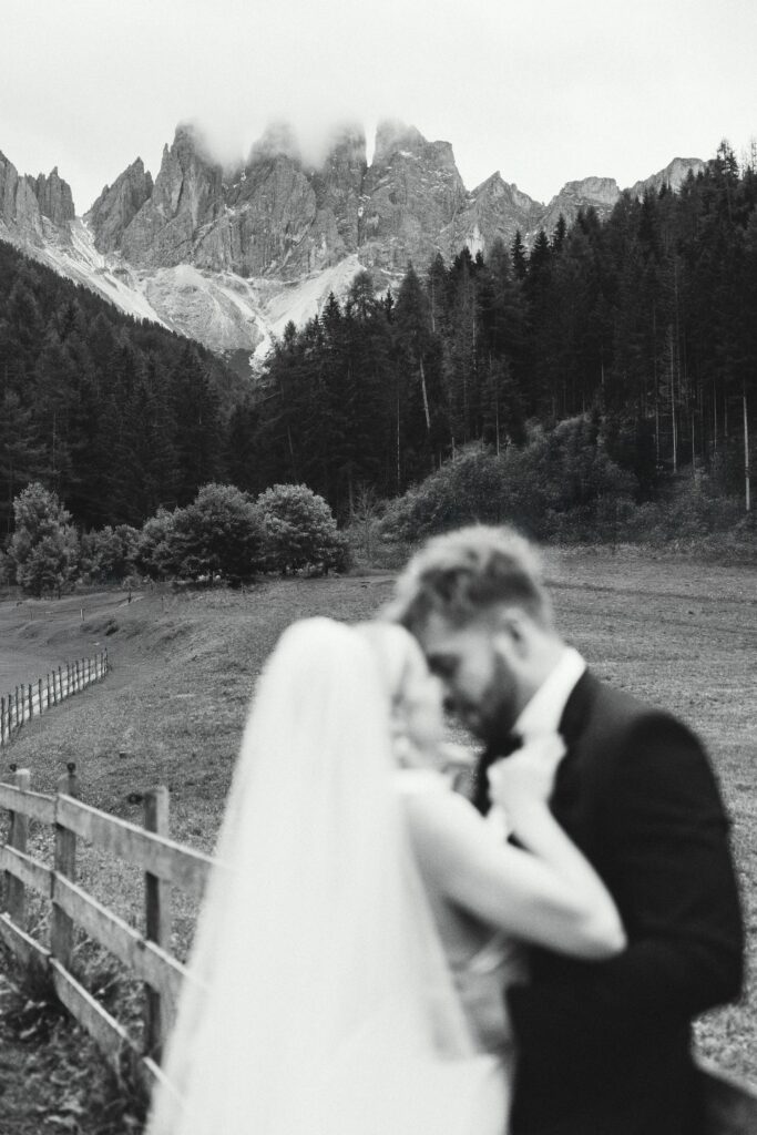 bride and groom under St. Magdalena mountains for their elopement