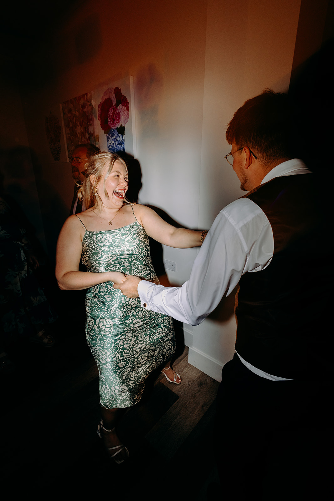 Evening dance floor with vibrant movement and motion blur — Derbyshire wedding party vibes.