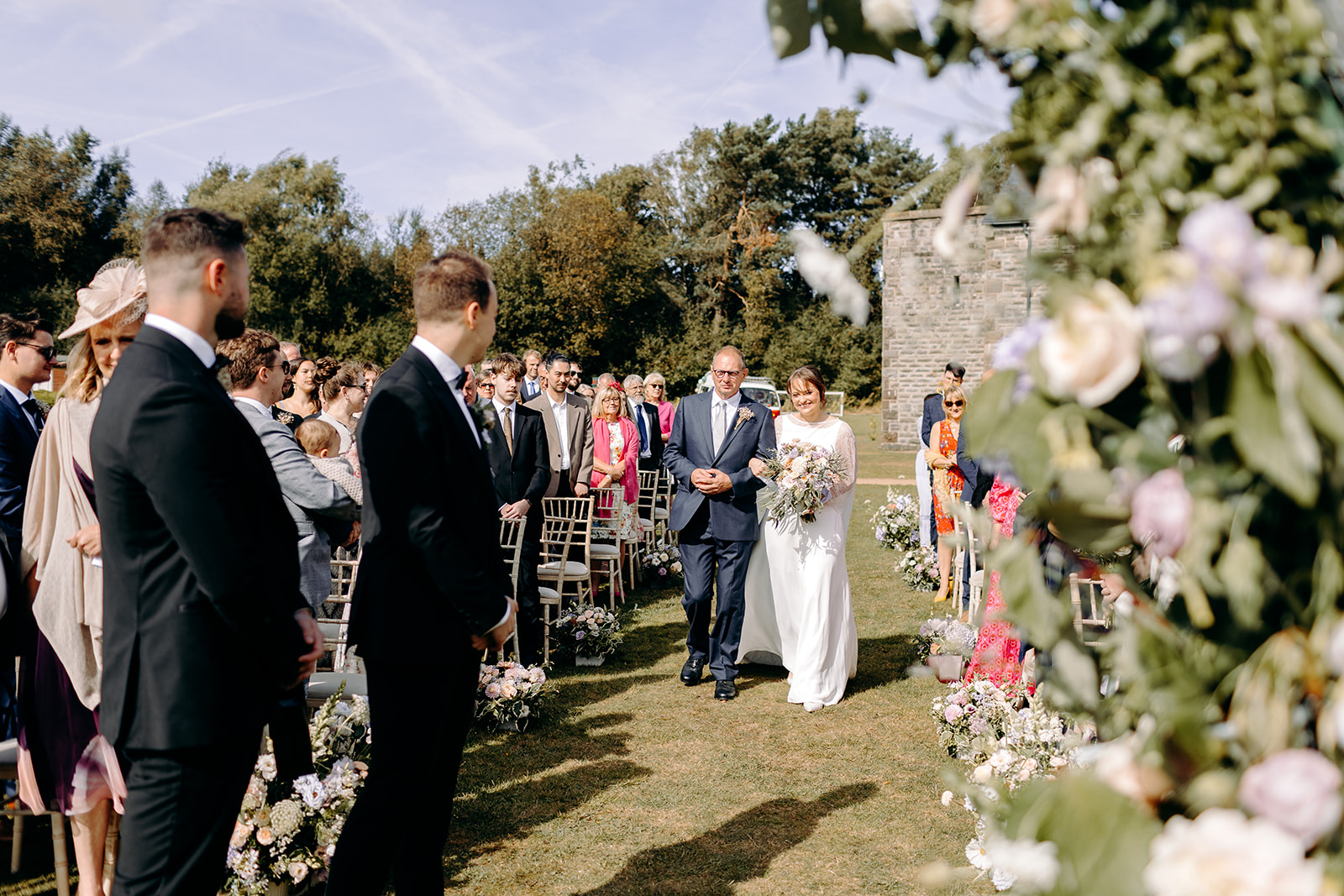 Bride walking down the aisle at Darwin Lake, captured in a natural light documentary wedding style.