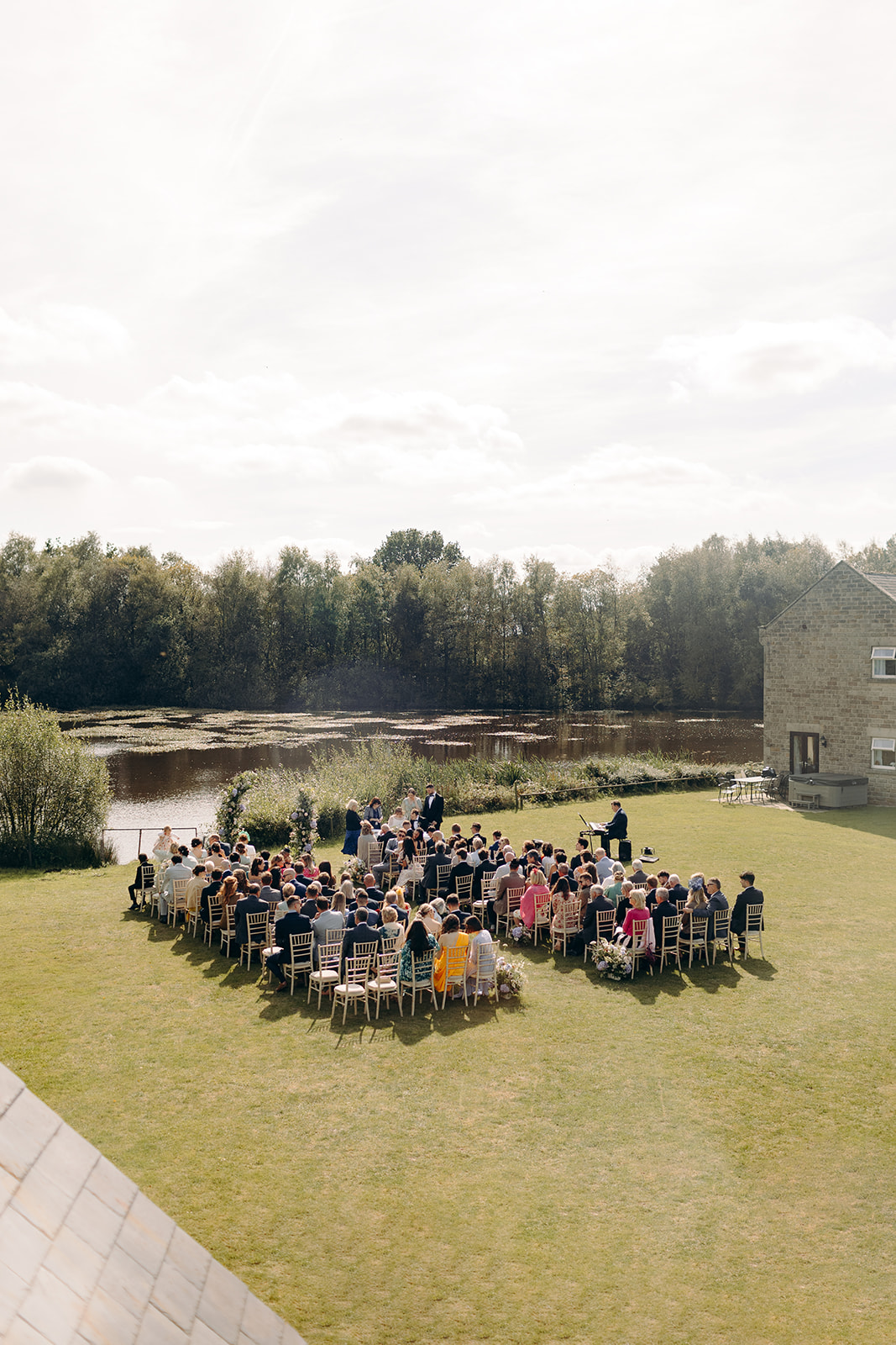 View from above of the wedding ceremony by Darwin Lakes, fun Derbyshire wedding photography.