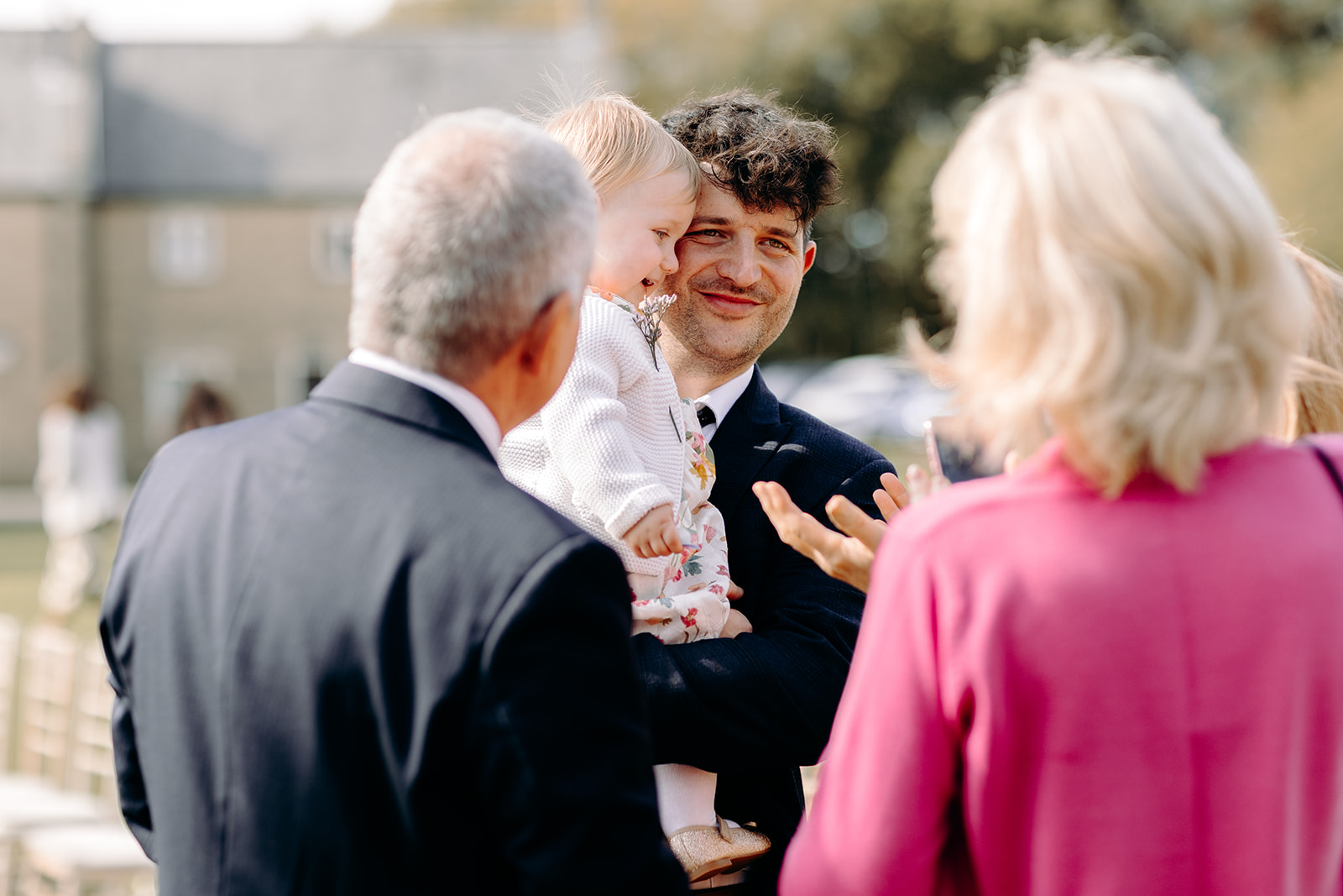 Candid wedding photography of guests chatting with each other during drinks reception at Darwin Lakes wedding.