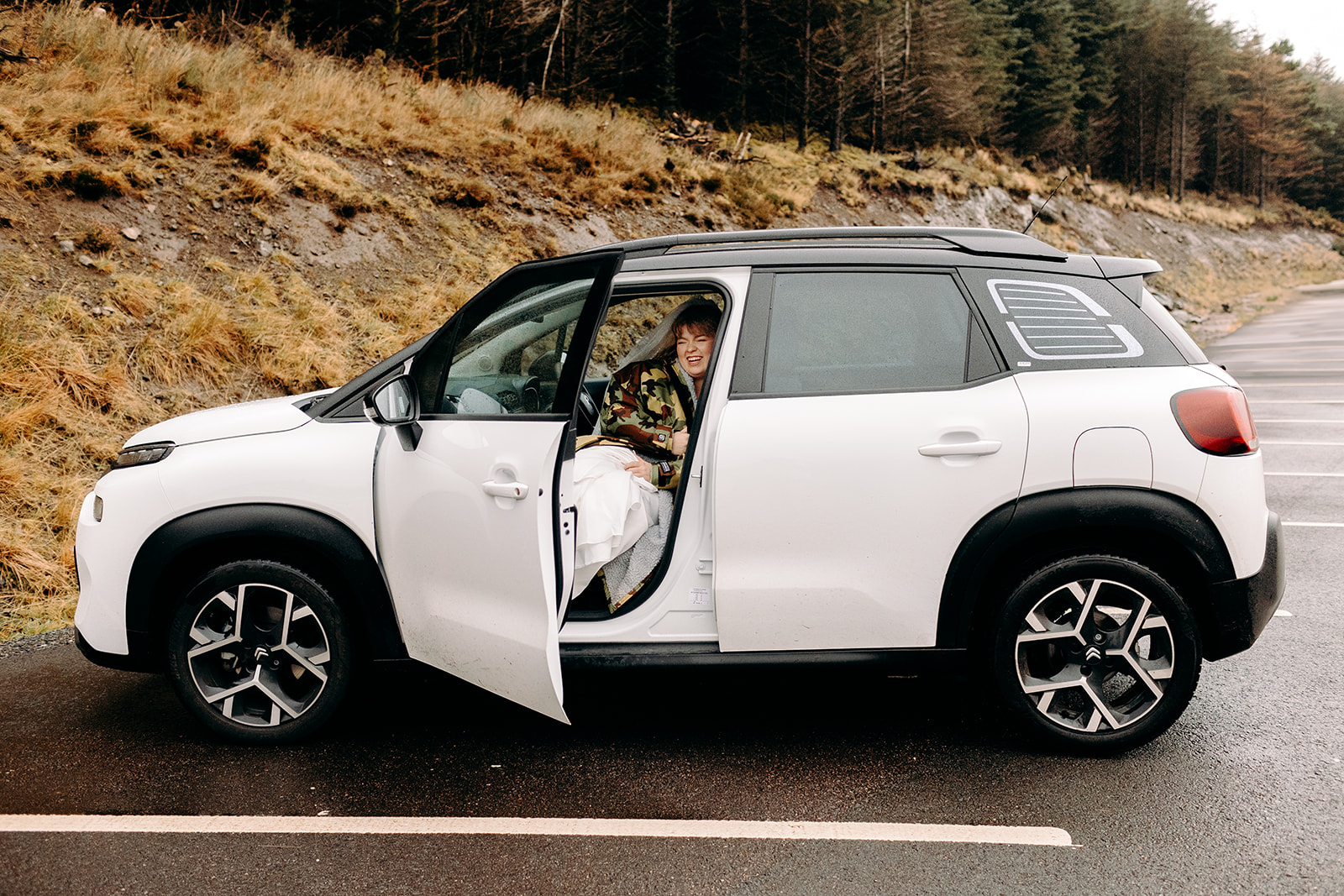 Couple arrives in their car, ready for adventurous Isle of Skye elopement.