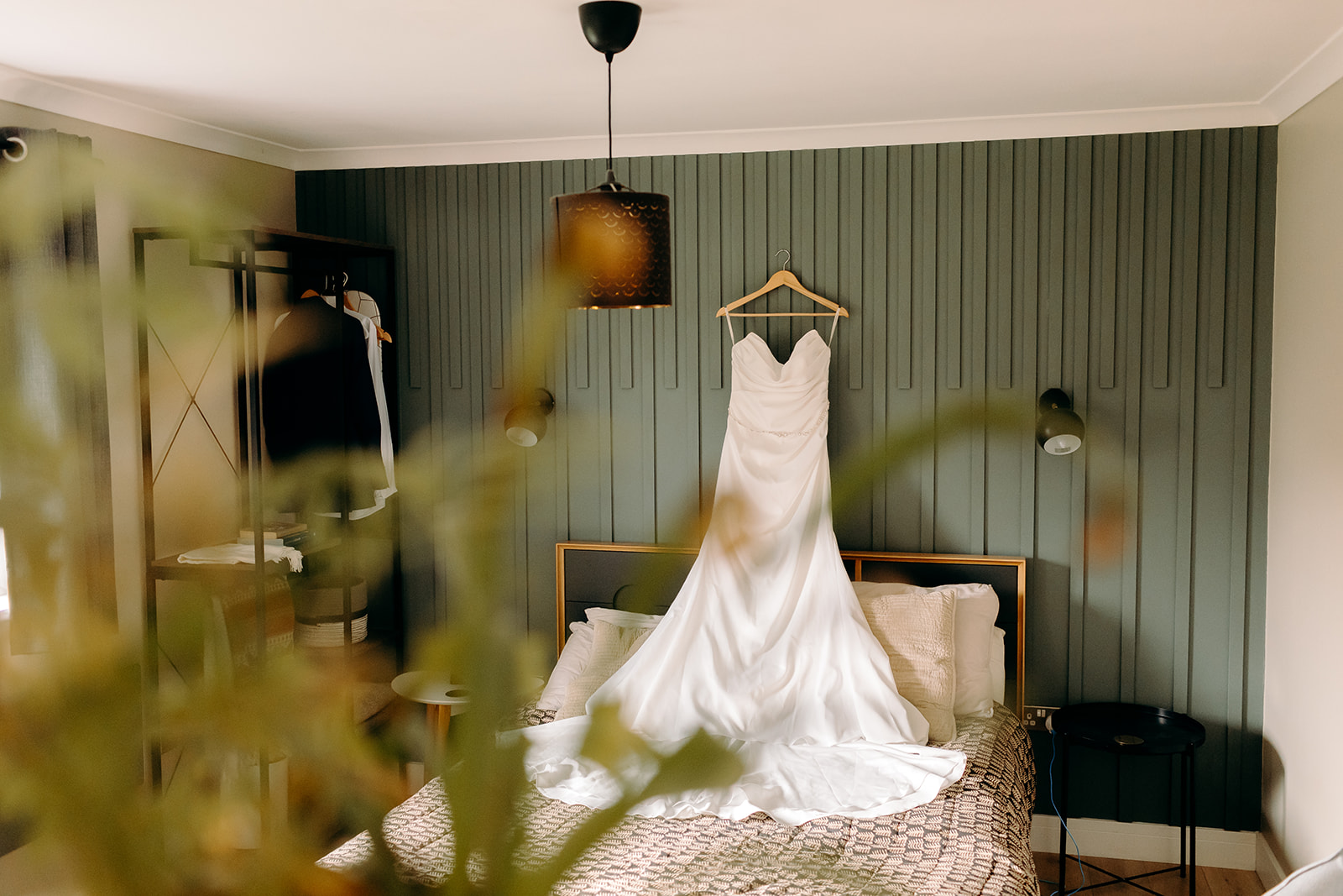 Bridal dress hanging in modern lodge, ready for an Isle of Skye elopement morning.