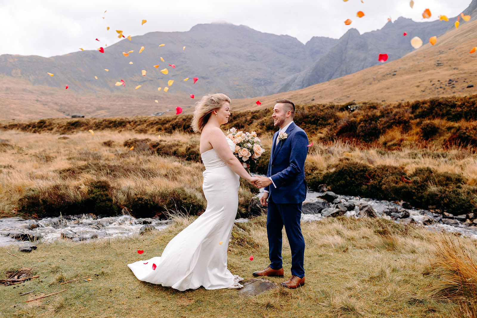 Couple celebrate with confetti during their vibrant Skye elopement