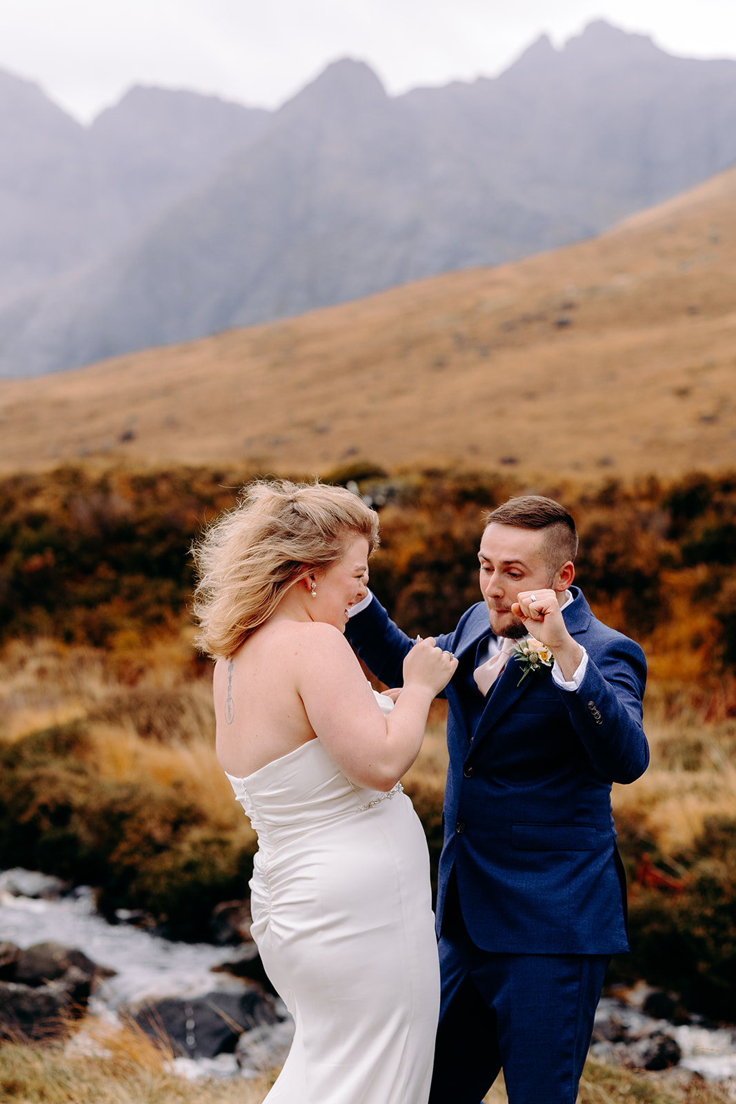 Bride and groom celebrating their Scottish ceremony with a first dance in the mountains