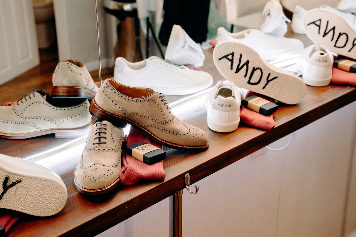 Custom wedding Converse reading “ANDY” with groom’s Lord of the Rings cufflinks – a fun personal detail from a Marleybrook House wedding.
