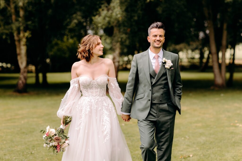 Bride and groom walking through the gardens of Marleybrook house, Kent Wedding Photography