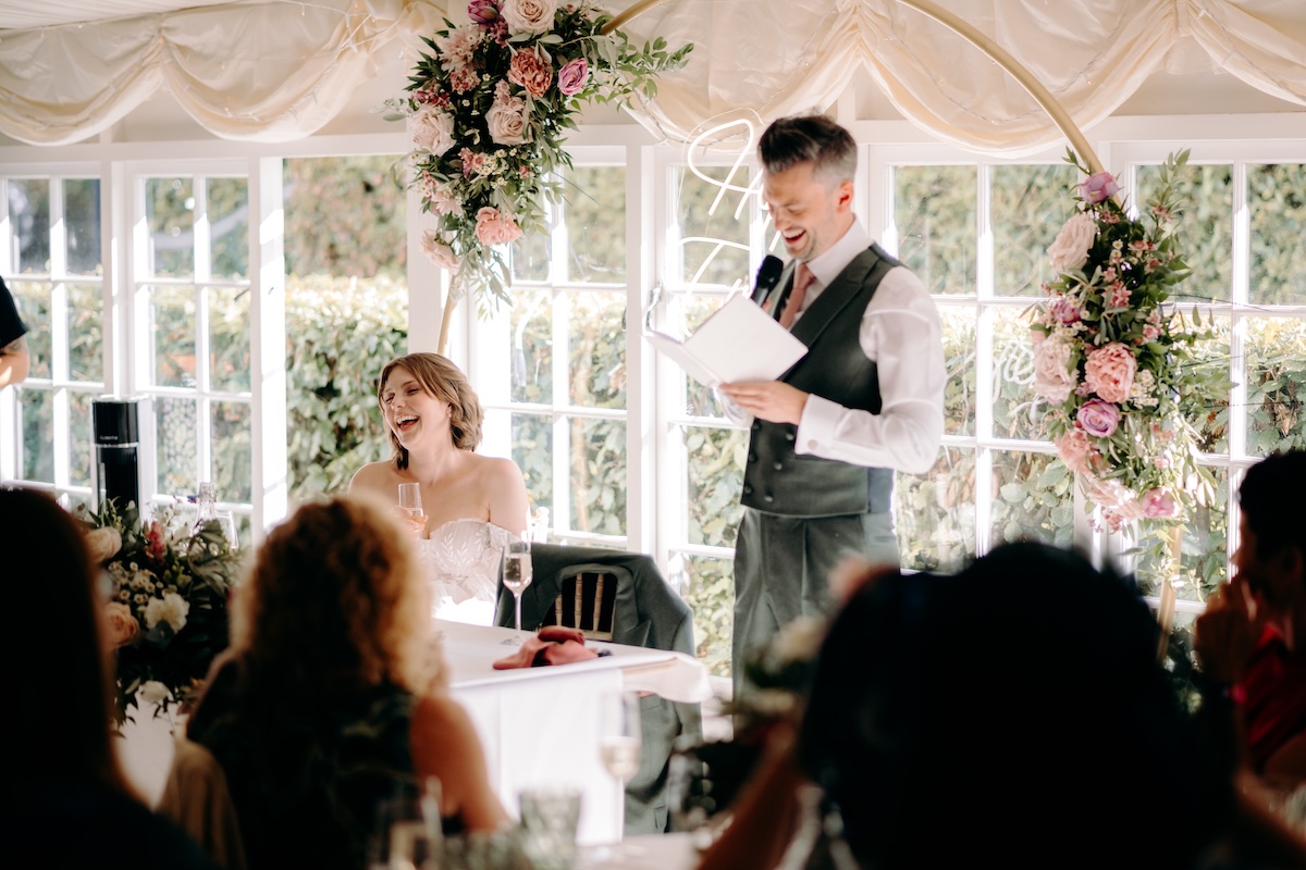Natural photography of the speeches at a summer wedding at Marleybrook House