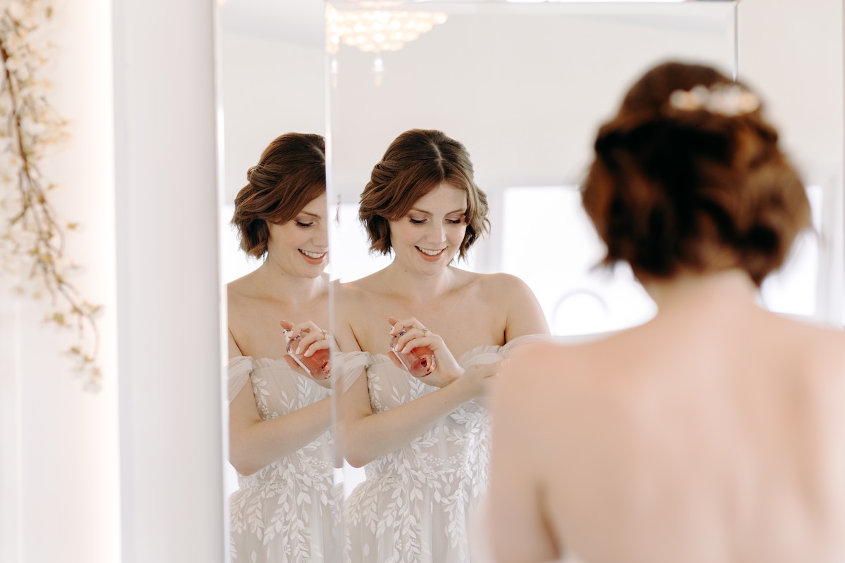 Close-up of bride’s radiant smile in soft morning light – candid bridal prep photo at Marleybrook House.