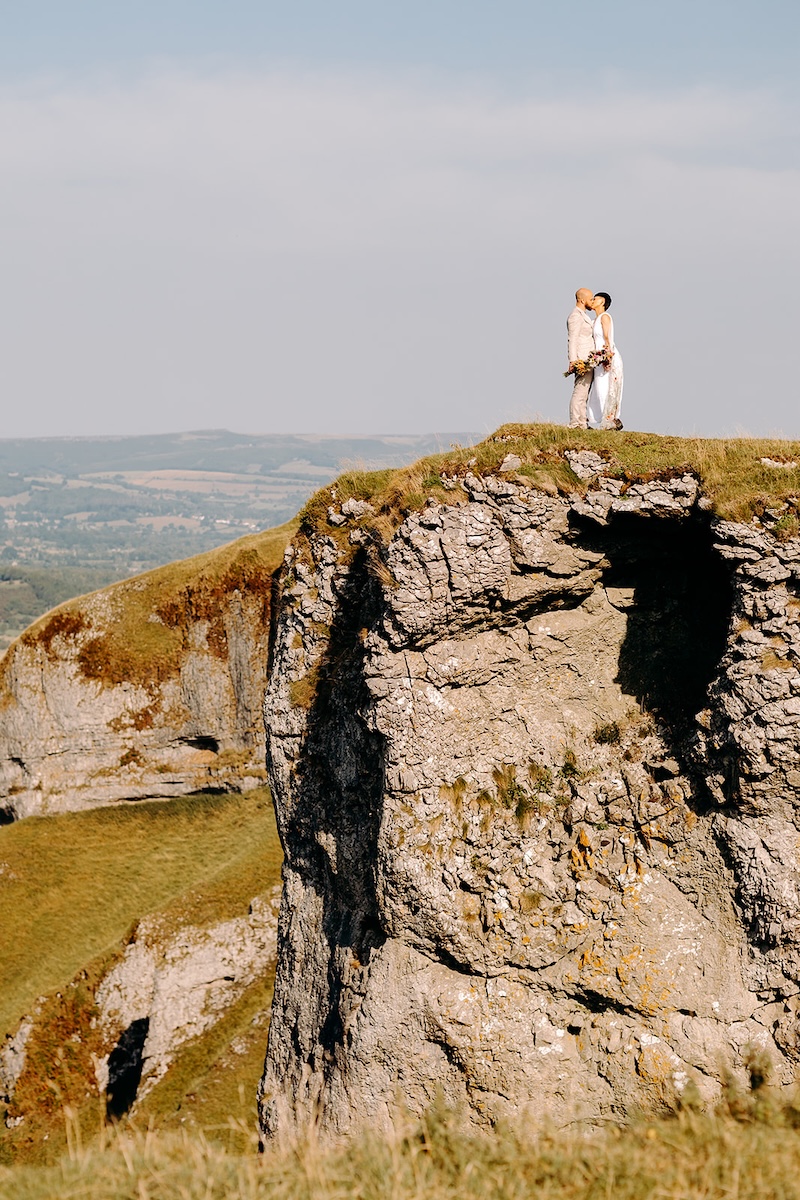 Close portrait of smiling eloping couple captured by a Peak District elopement photographer.