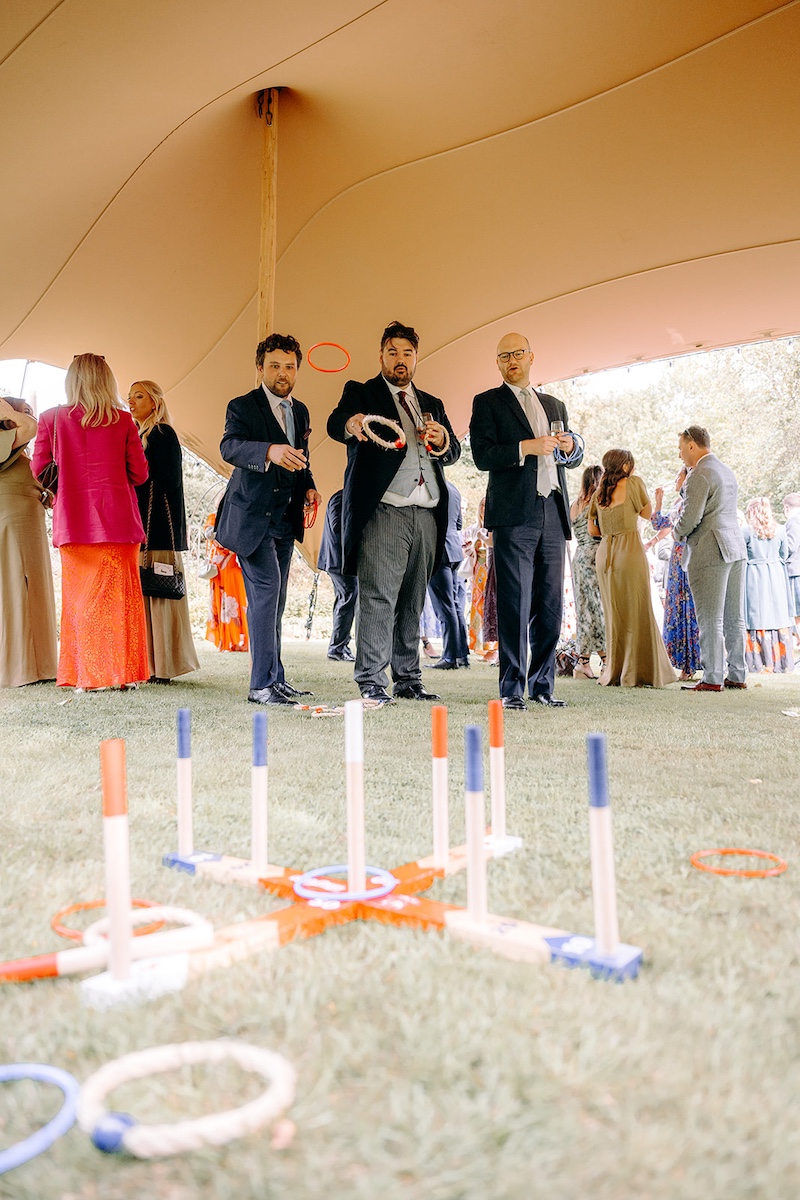 Wedding guests playing lawn games at Eyam Hall, fun wedding photography.