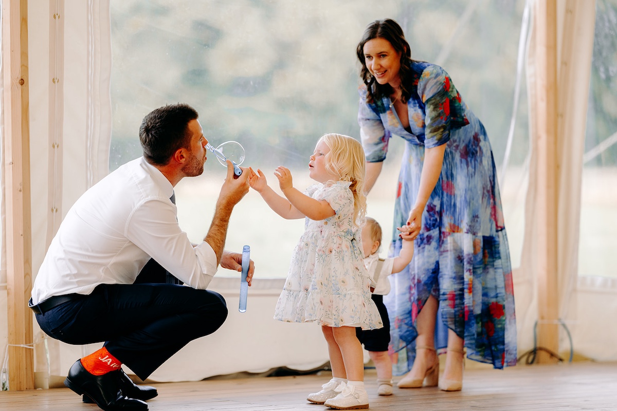Children blowing bubbles at wedding – Derbyshire wedding photographer candid style.