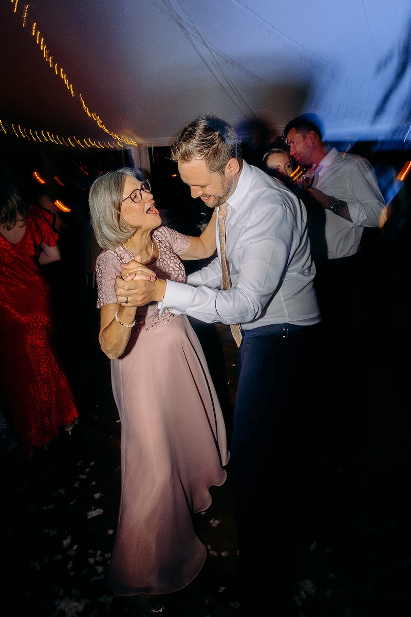 Groom dancing with his mum n the dance floor during Peak District wedding reception.