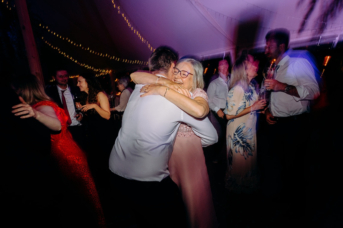 Groom dancing with his mum n the dance floor during Peak District wedding reception.