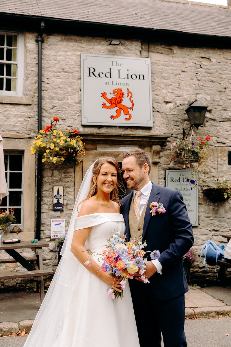 Bride and groom outside their favourite pub in the Peak District – Derbyshire wedding photography.