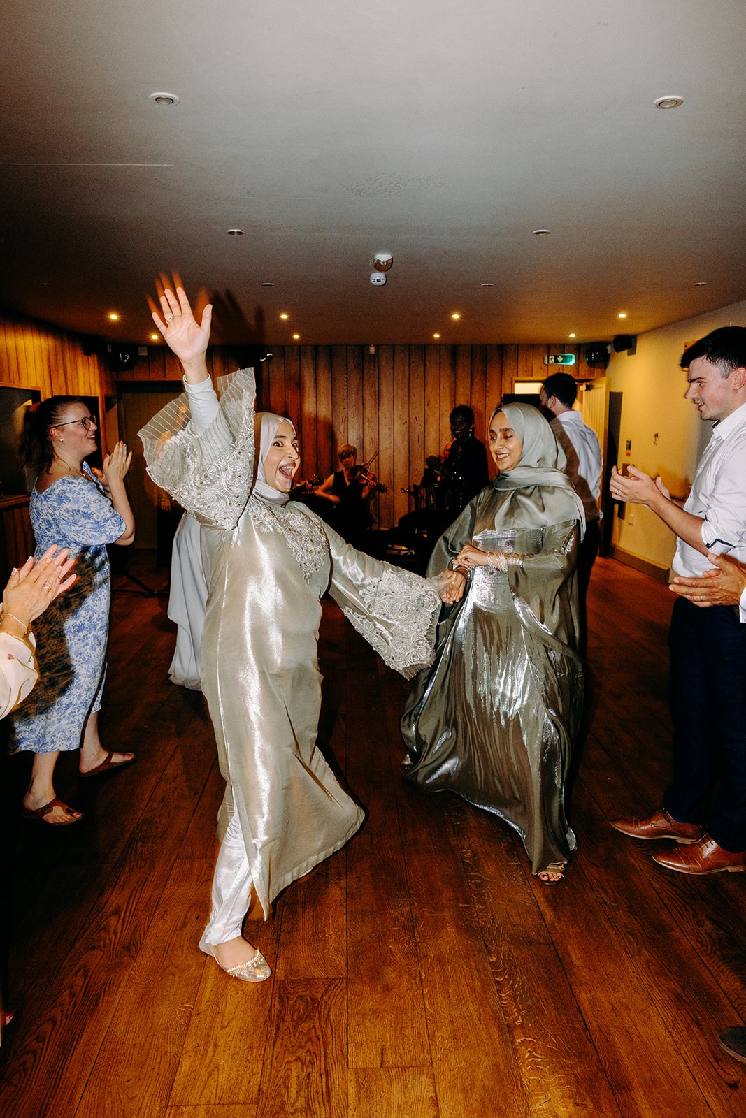 Lively ceilidh dancing with guests spinning and laughing on the dance floor at Ashes Barns.