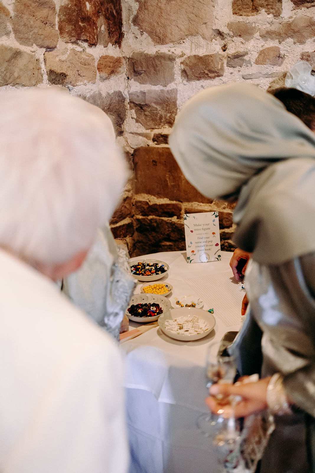 Wedding guests making themselves as lego characters - an alternative wedding guest book idea.