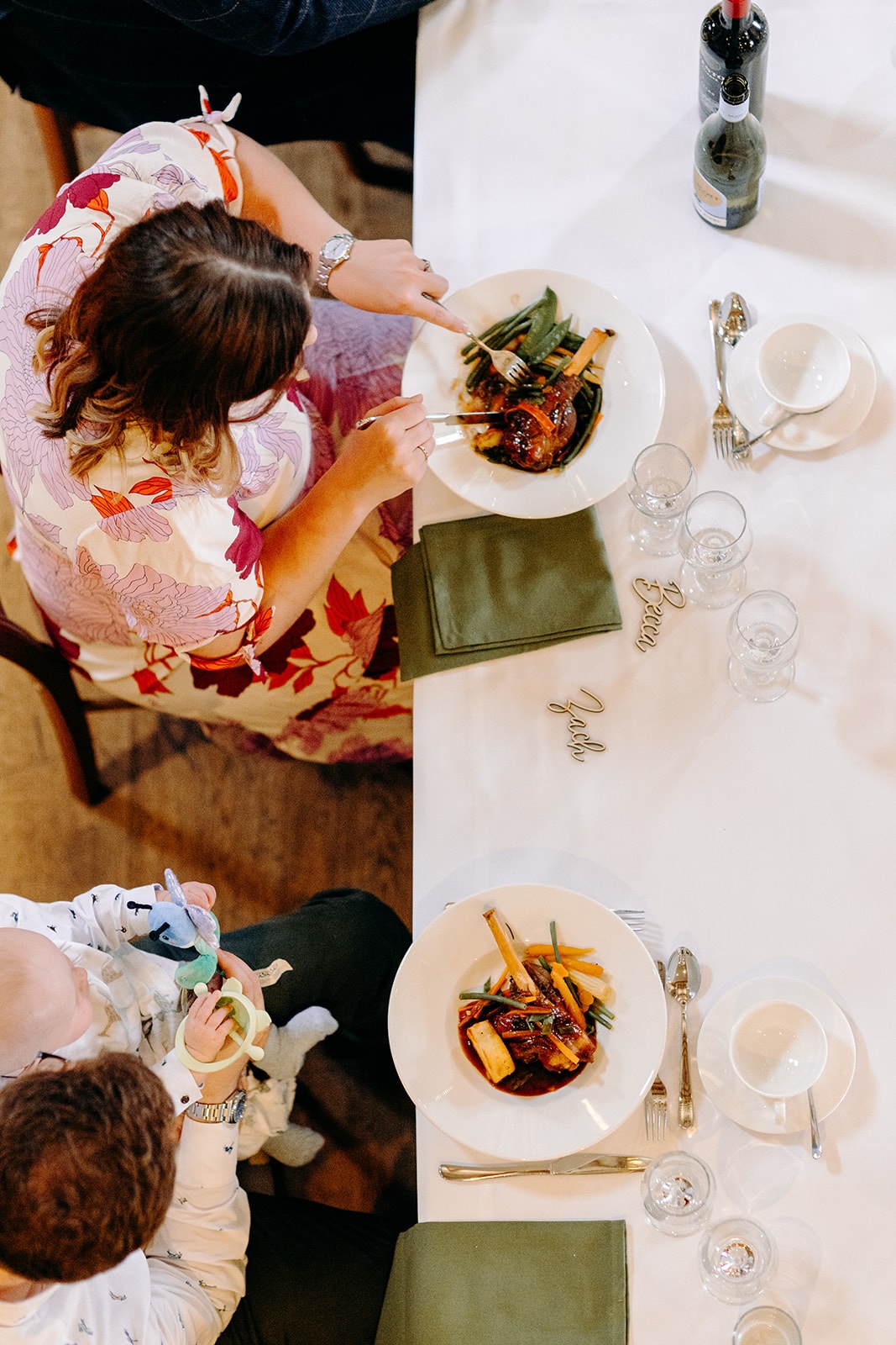 Overhead shot of colourful plates and sharing dishes during the Ashes Barns wedding meal.