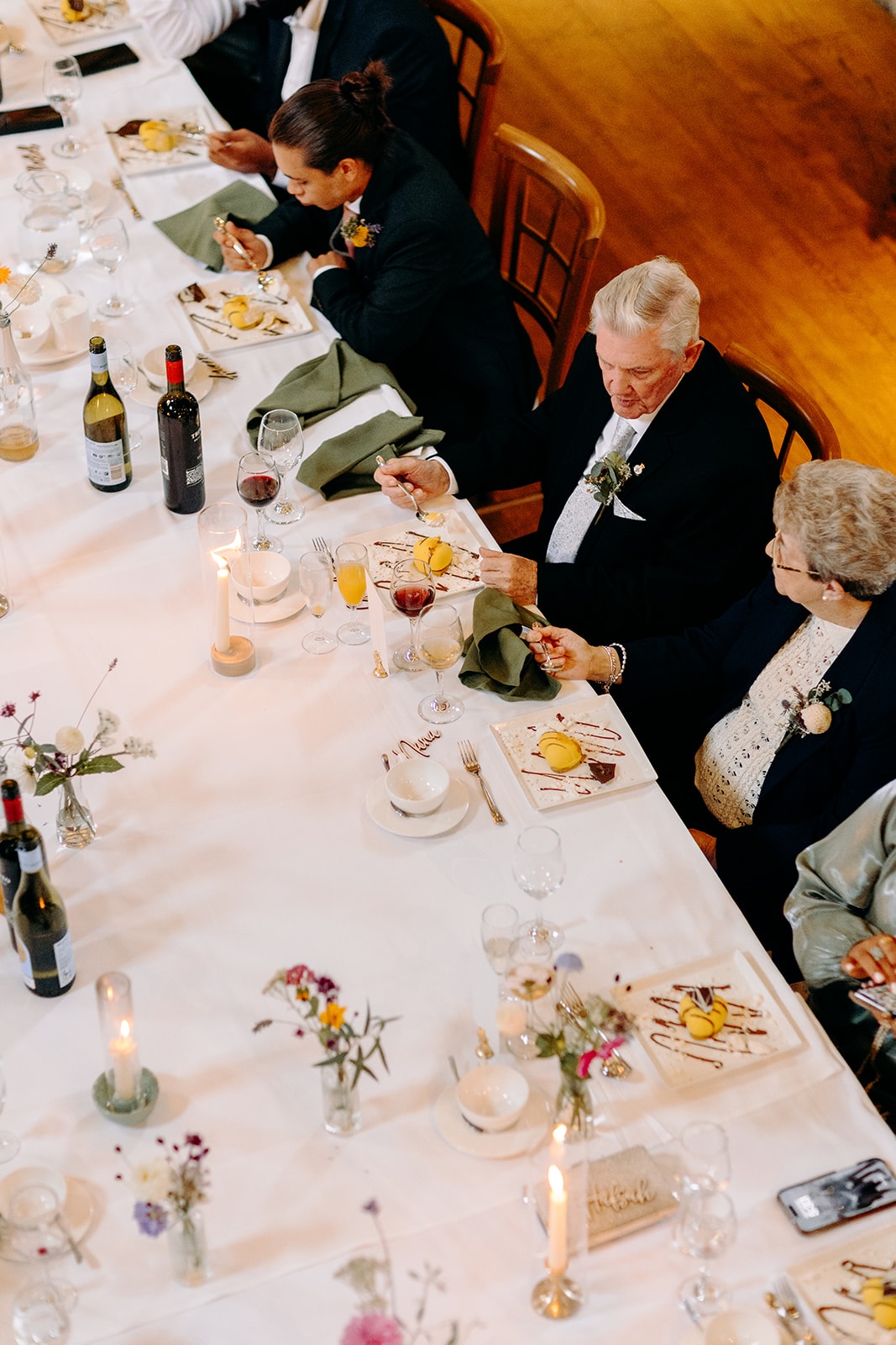 Overhead view of guests enjoying the wedding breakfast together at Ashes Barns.