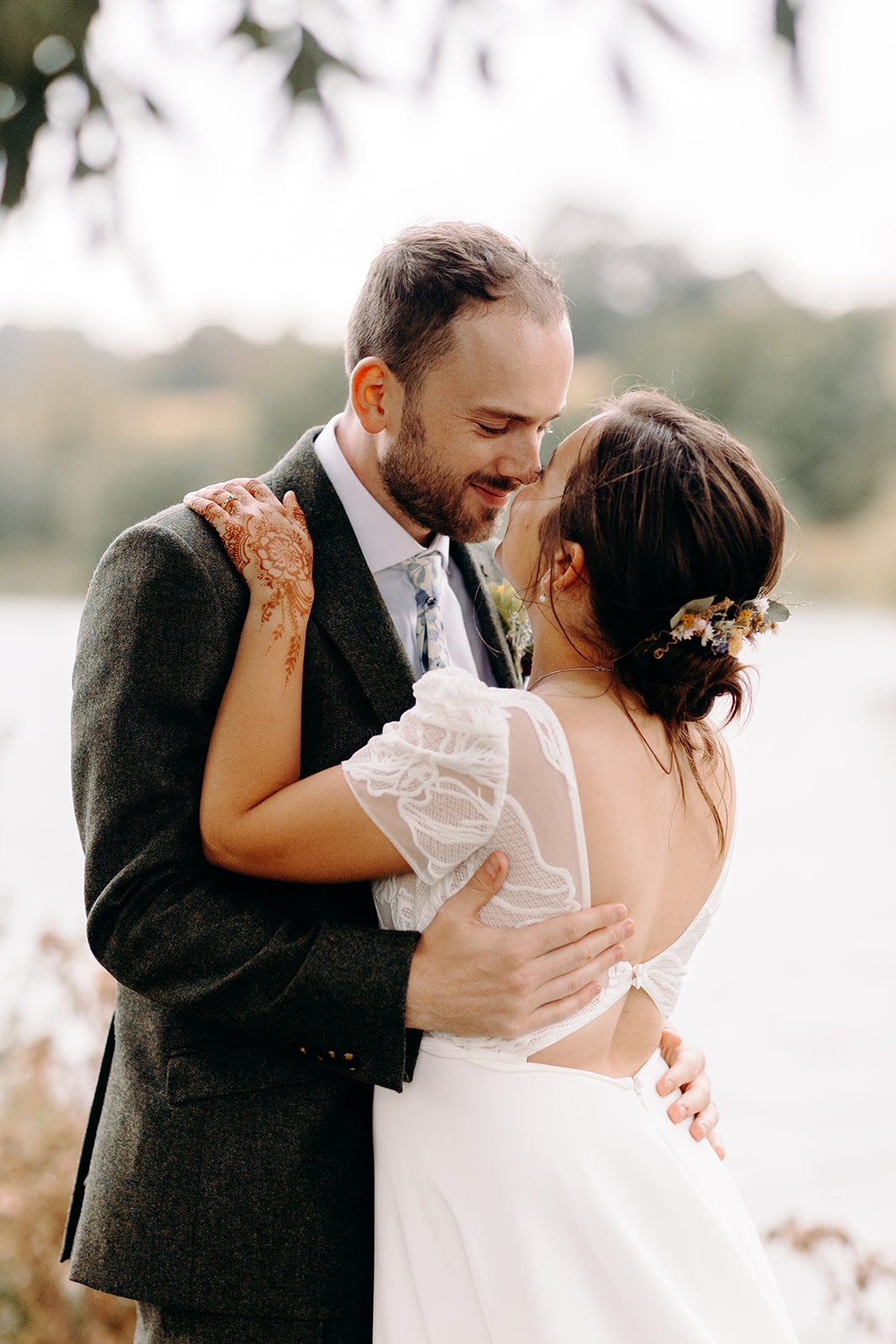 Intimate portrait of the couple cuddling together during their Peak District wedding.