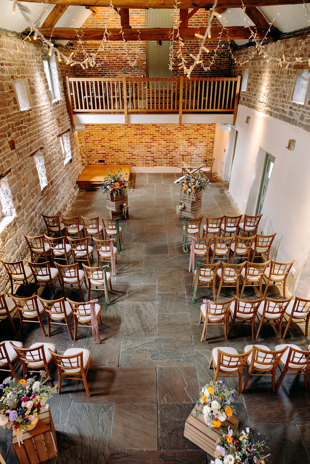 Overhead view of ceremony chairs arranged for an intimate Ashes Barns wedding ceremony.