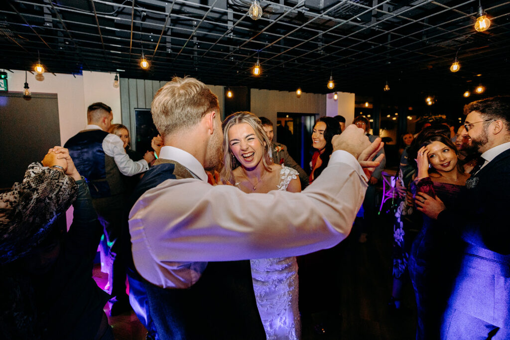 Bride and groom dancing together during first dance at Whistle Barns, photographed by a Whistle Barns wedding photographer