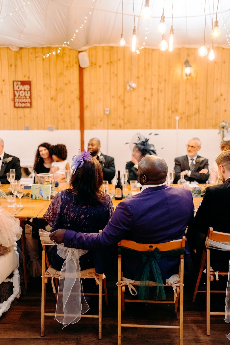 Parents seated at the top table during the reception meal at The Wellbeing Farm.