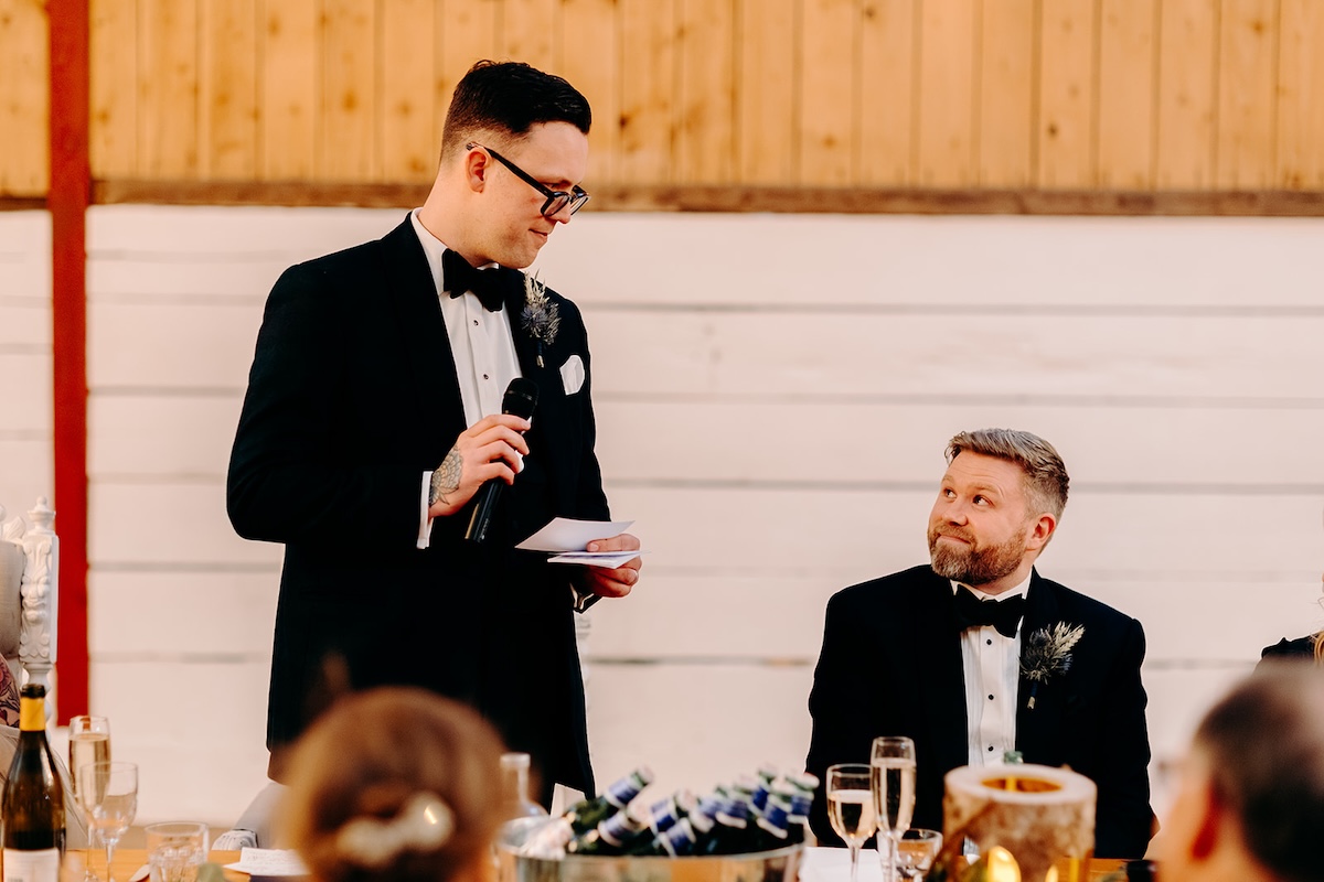 Groom standing to give a speech during the wedding breakfast at The Wellbeing Farm.