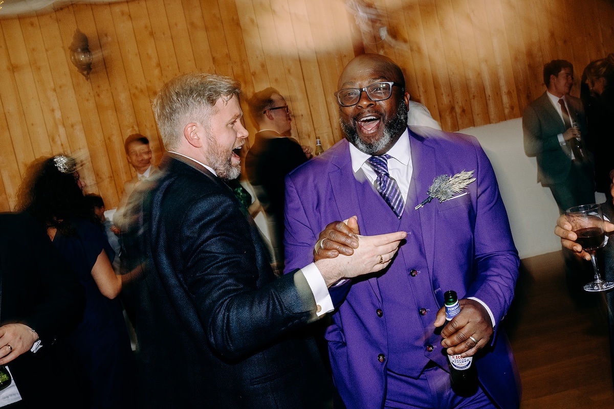 Guests chatting and laughing together during the lively dancefloor celebration.
