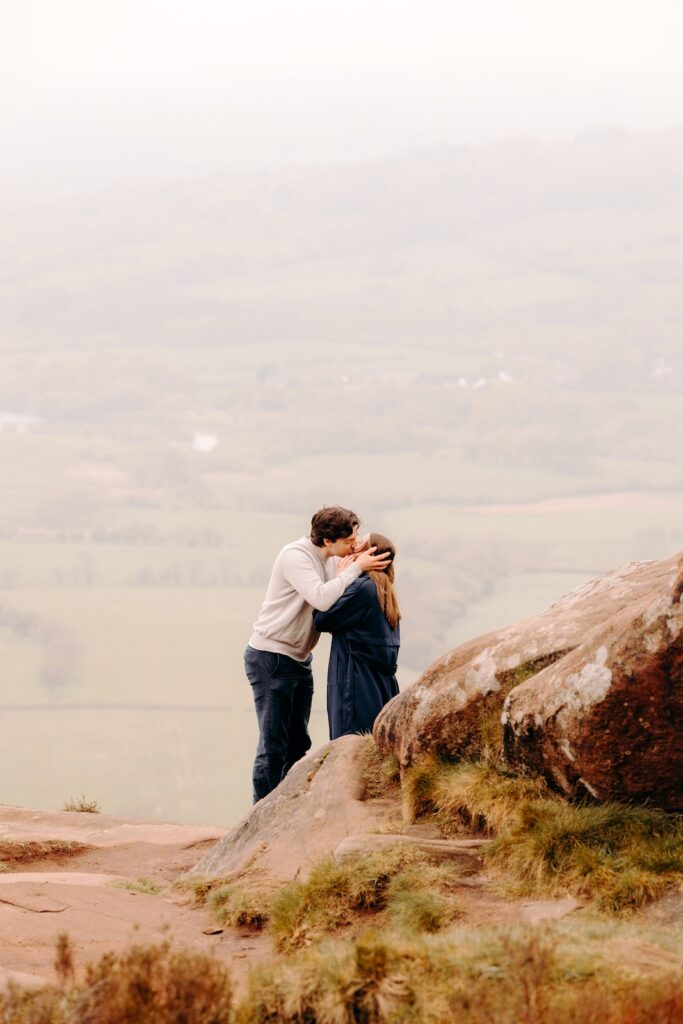 Couple getting engaged during adventurous Peak District proposal photography