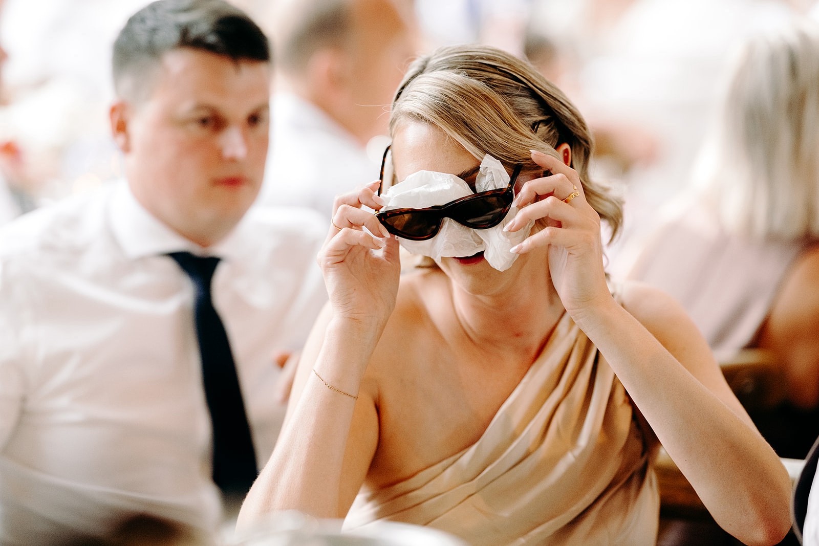 Guests laughing during the speeches at Derbyshire wedding.