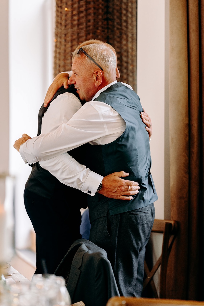 Emotional hug during the wedding speeches at Thornbridge Hall.