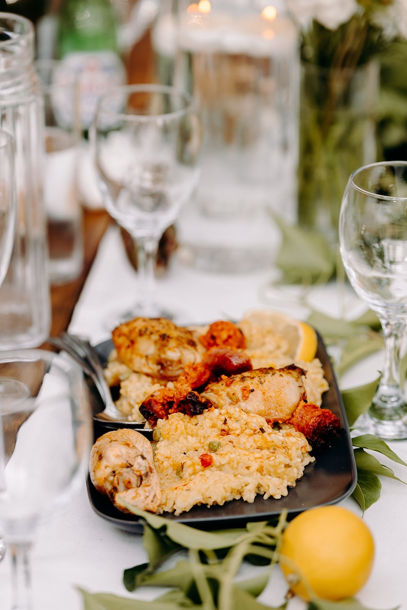 Wedding breakfast being served inside The Carriage House at Thornbridge Hall.