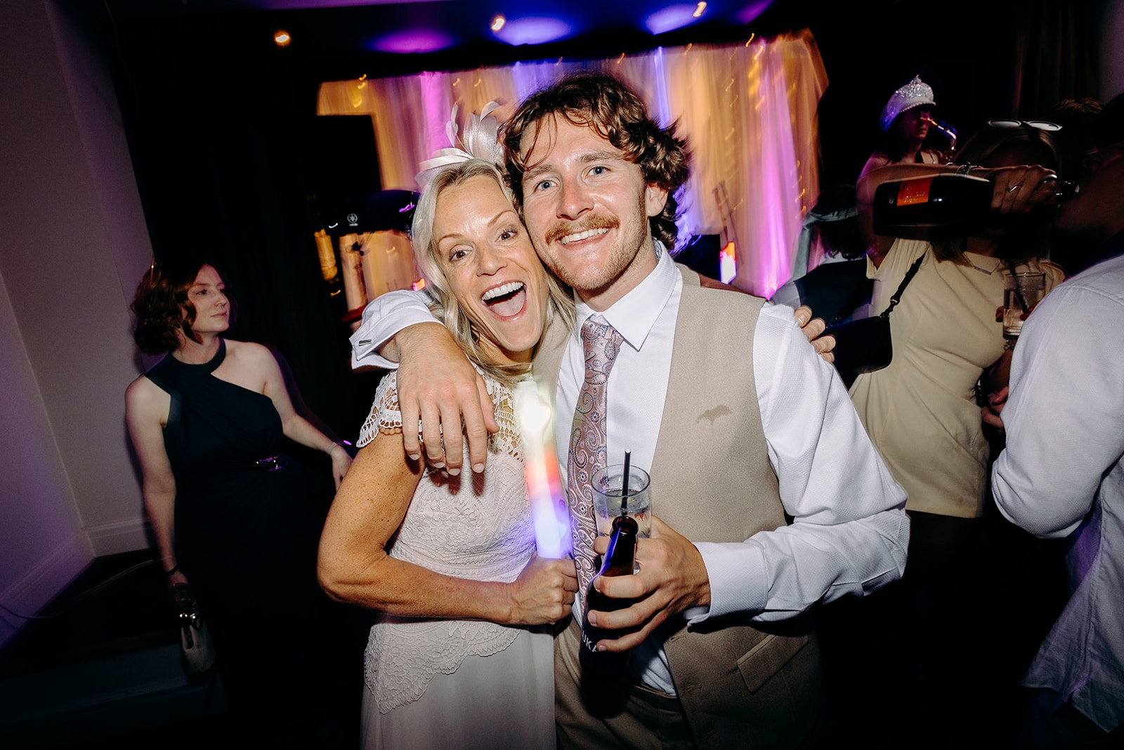 Guests posing together during the colourful late-night wedding celebrations.