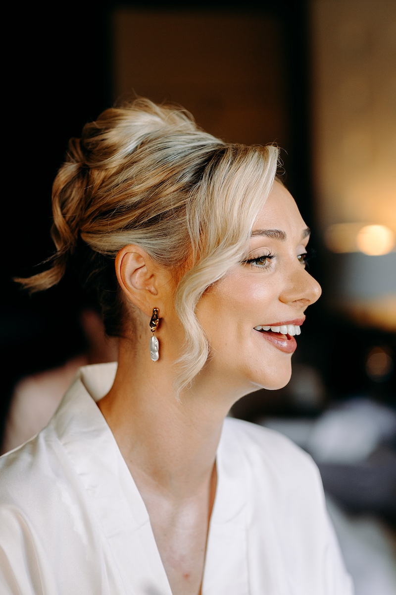 Natural bridal portrait during morning preparations, photographed at Thornbridge Hall in the Peak District.