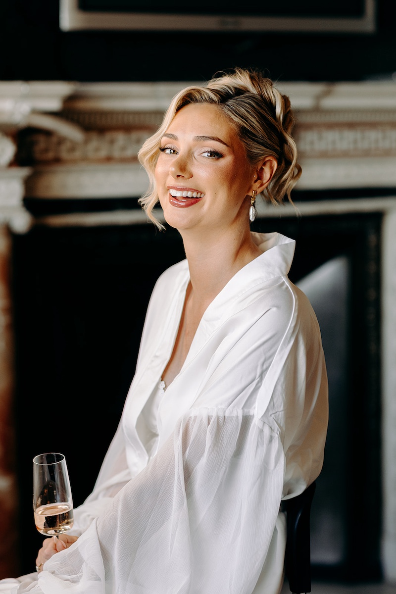 Smiling bridal portrait during morning preparations for a Thornbridge Hall wedding.