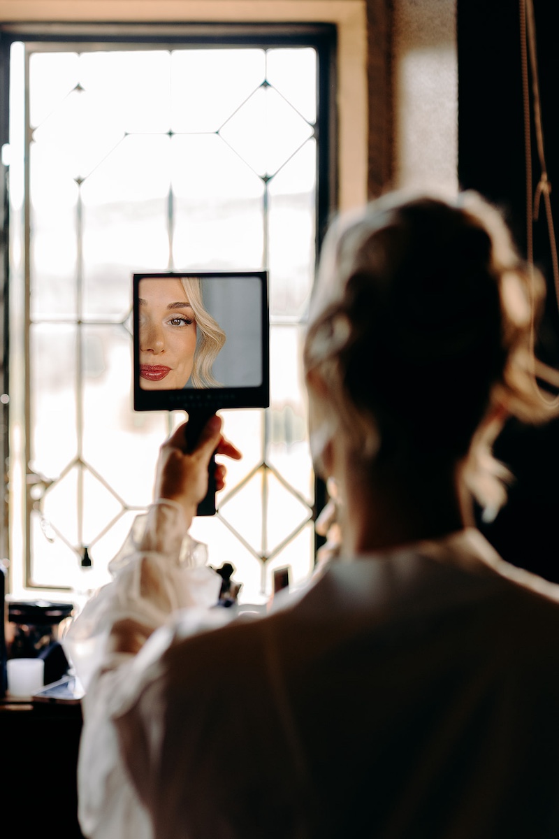 Mirror selfie during the final wedding morning preparations at Thornbridge Hall.